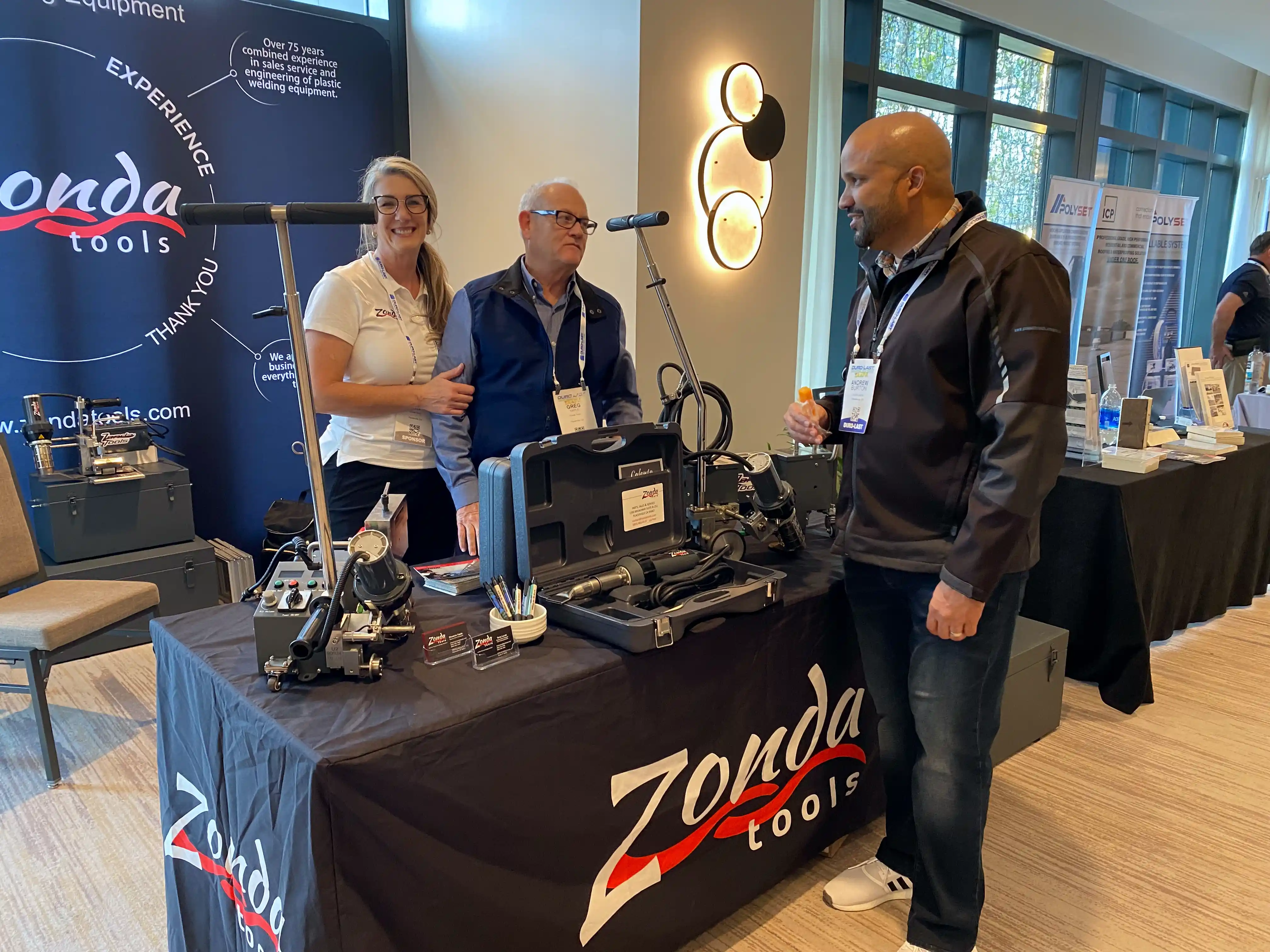 Trade show display with Zonda equipment and team